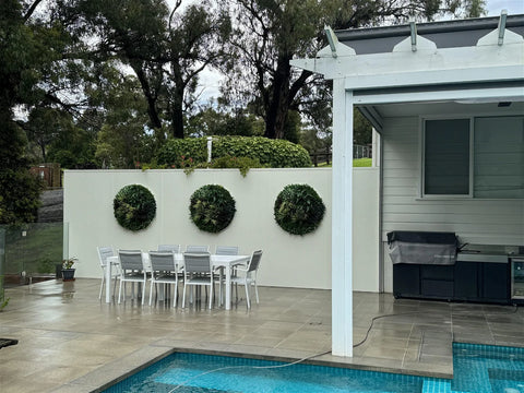 Slimline Artificial Green Wall Disc 100cm white by the pool